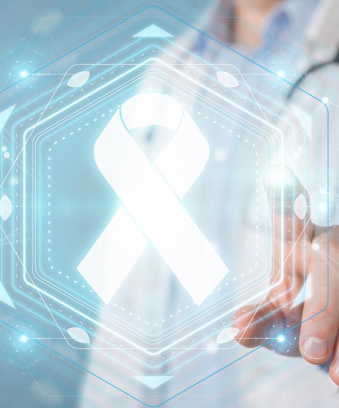 A doctor points at a graphic of a cancer ribbon